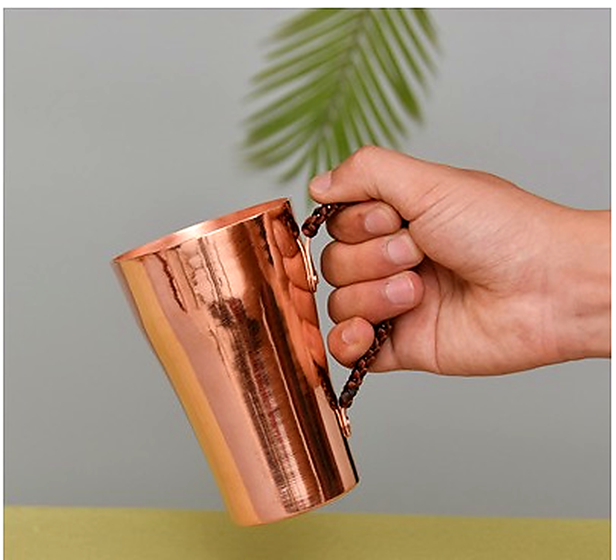 Copper Cup with handle held in hand