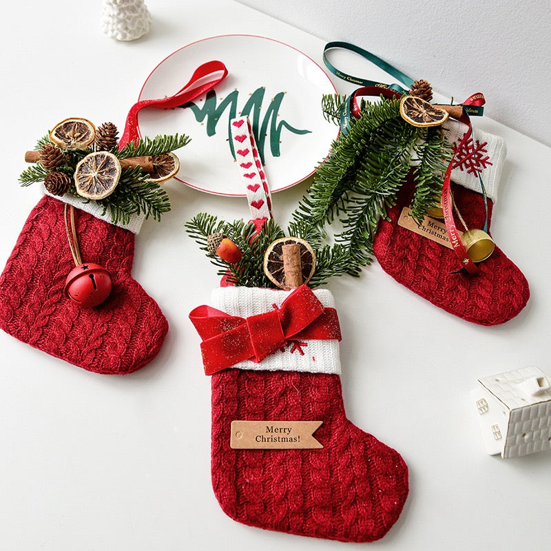 Knitted Christmas stockings styled on a table