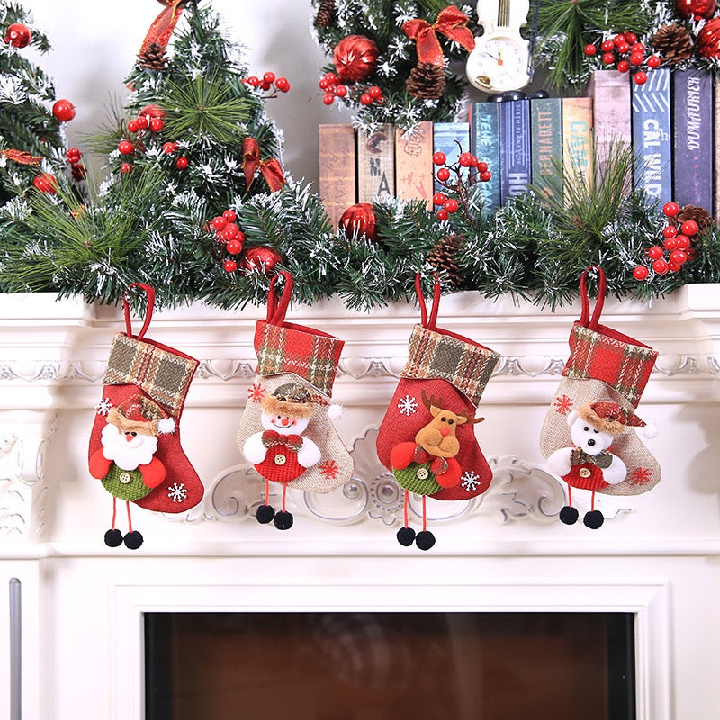Christmas stocking ornaments hanging on a mantelpiece