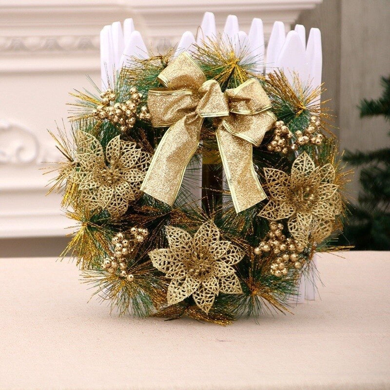 Gold Christmas wreath with glitter poinsettia flowers and ribbon bow