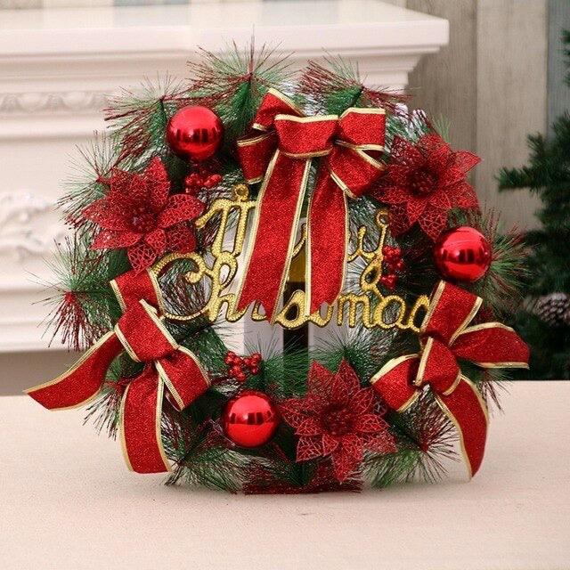 Red Christmas wreath with baubles, bows and gold lettering