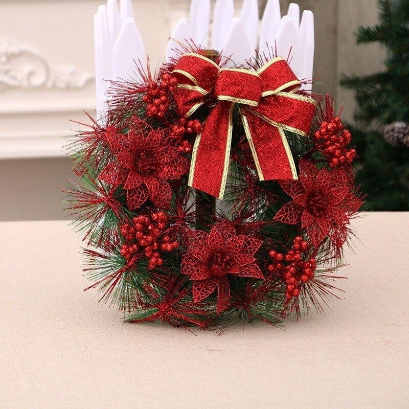 Red Christmas wreath with glitter poinsettia flowers and ribbon bow